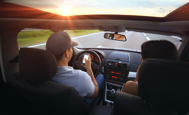 Motorist engaged in texting while driving.