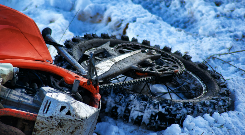 Motorcycle accident - bike fallen in snow.